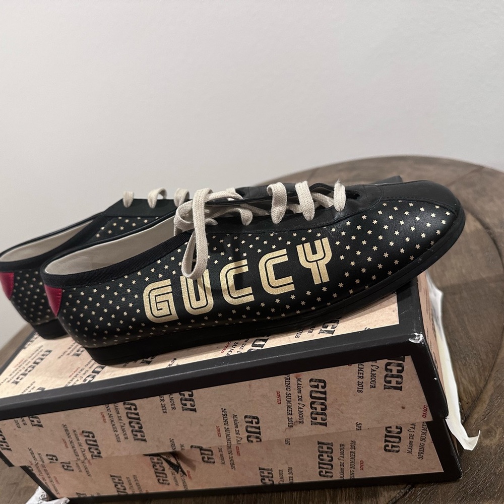 Authentic Gucci Black and Gold Sneakers